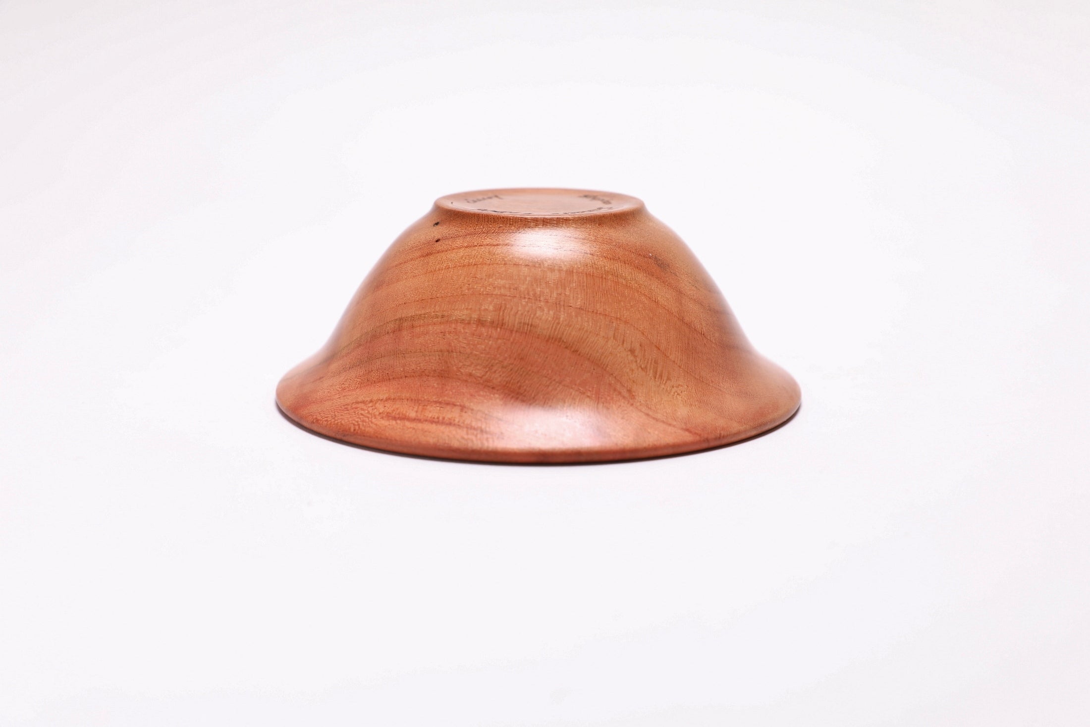 Small wild black cherry wooden bowl bottom view showing small raised foot and natural wood character