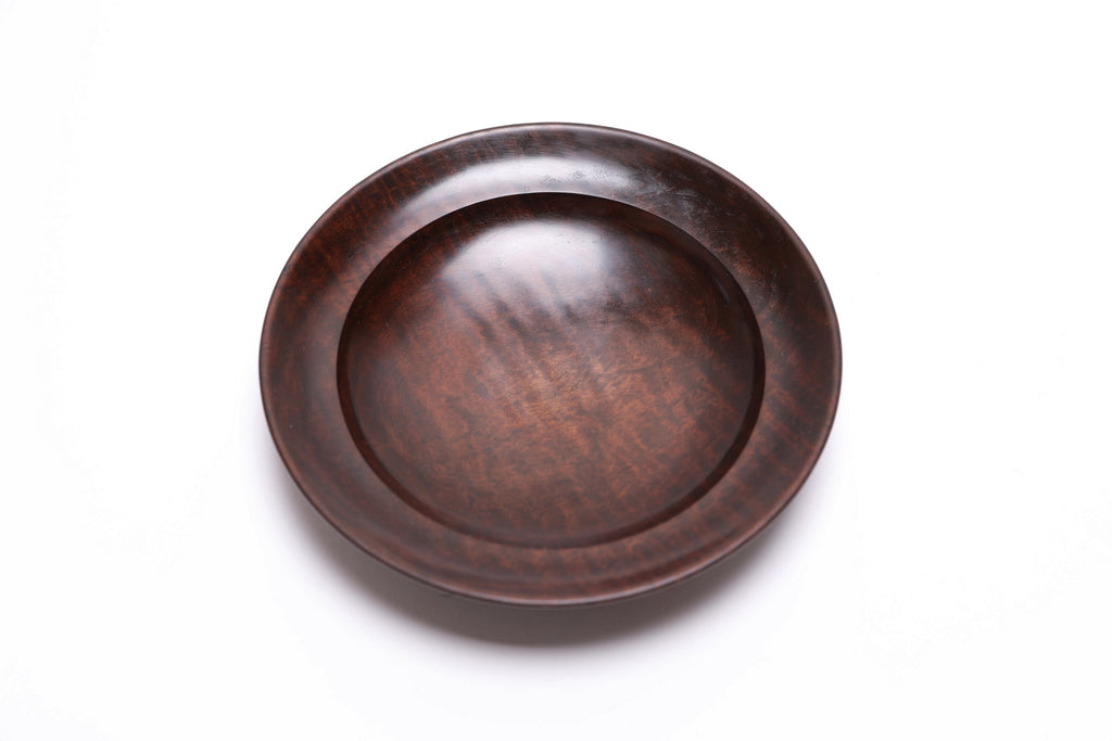 Thermally modified tiger maple wooden bowl top view rotated showing rich color variation across wood surface