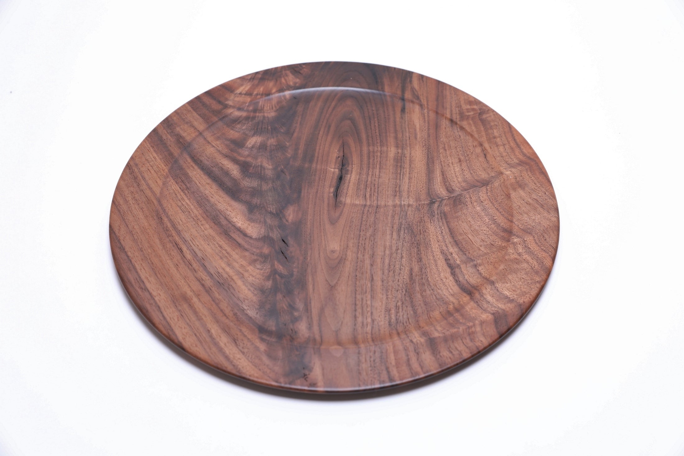 Wild black walnut wooden platter, top view rotated 45°, showcasing natural wood character