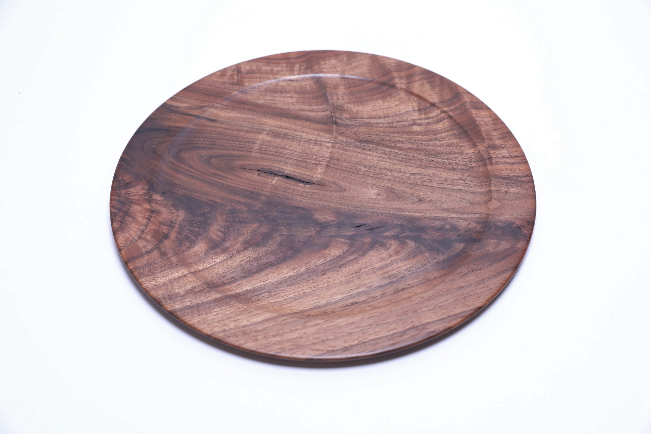 Black walnut burl platter, top view rotated 45°, natural edge and grain variation visible