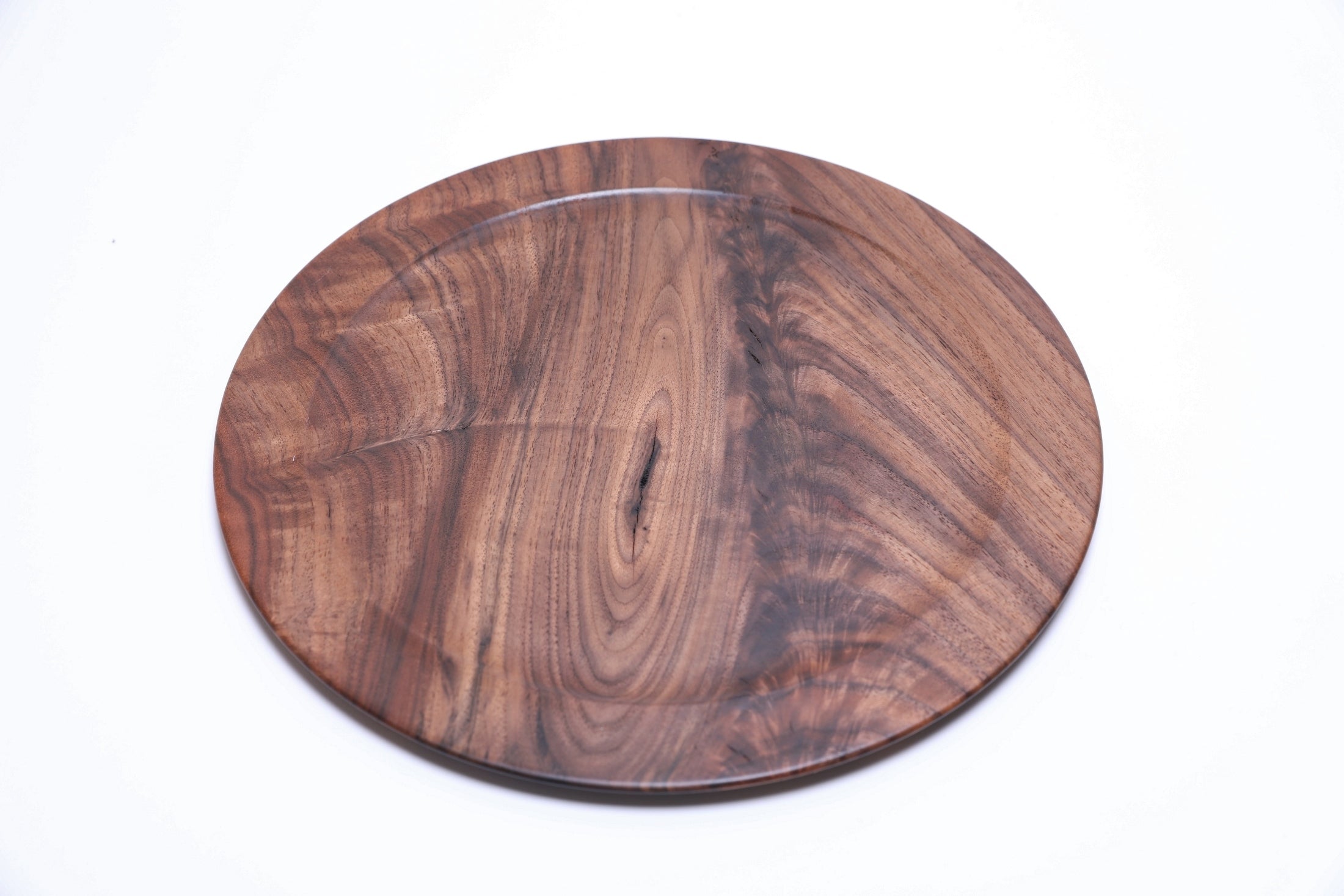 Handcrafted walnut crotch burl platter, top view rotated 45°, deep grain and natural finish