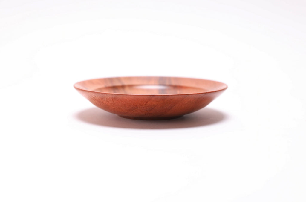 Wild black cherry wooden ring dish, side view at 180°, natural finish and raised foot visible