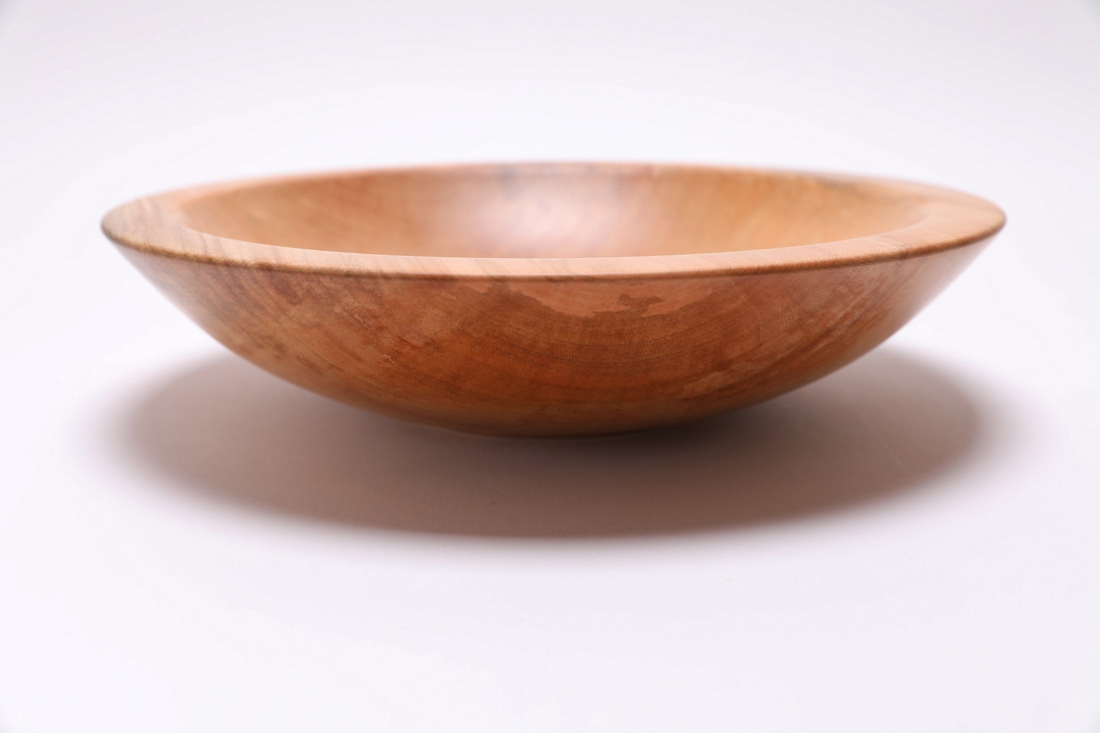 Sugar maple chopping bowl, side view at 0°, showing 2½" depth and raised foot