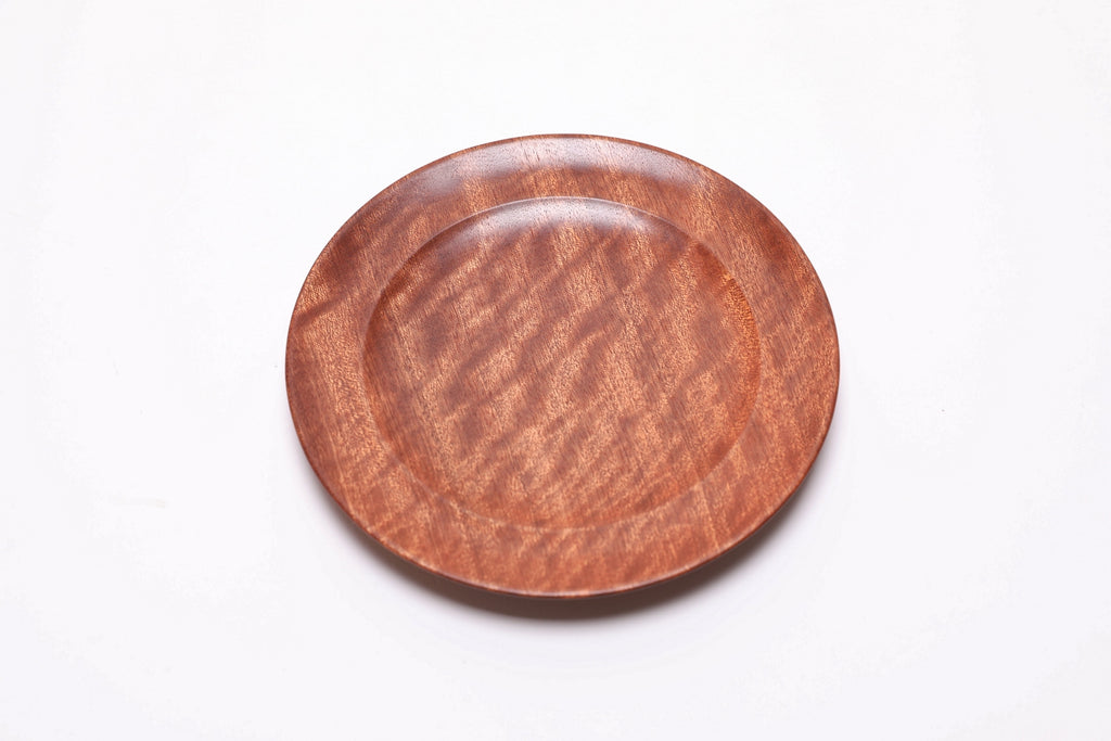 Pommele ribbon sapele wooden ring dish, top view rotated 45°, extraordinary figure radiating in natural light