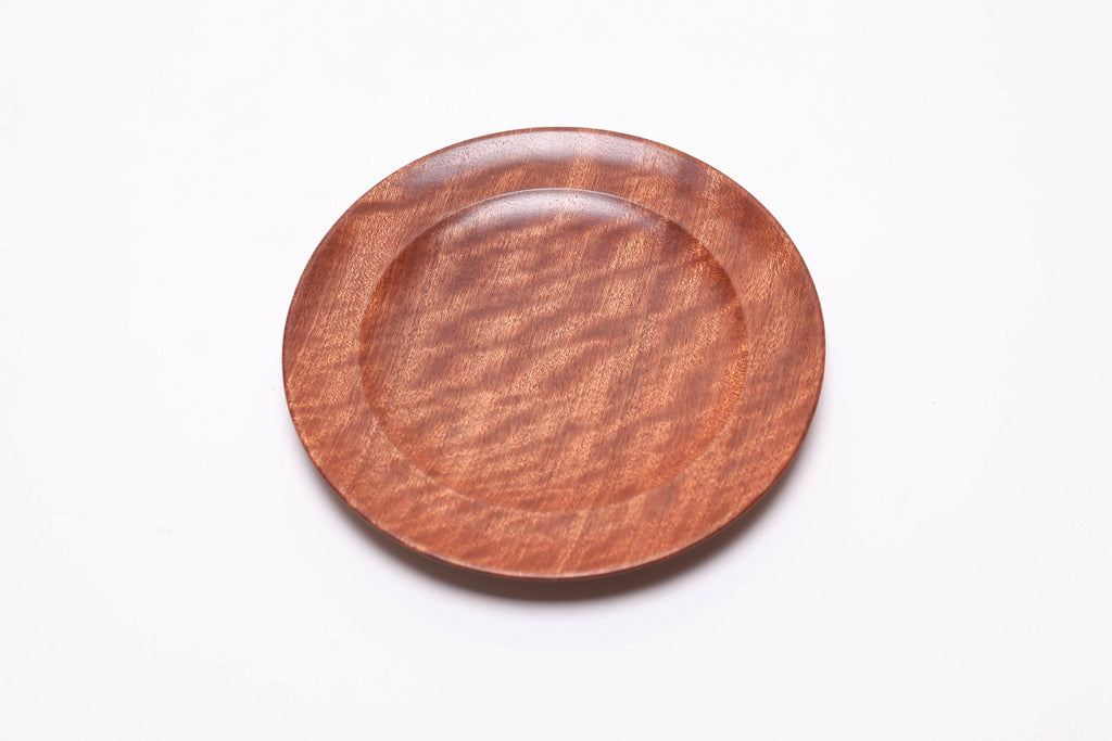 Pommele ribbon sapele wooden ring dish, top view rotated 45°, interlocking ribbon and pommele grain detail