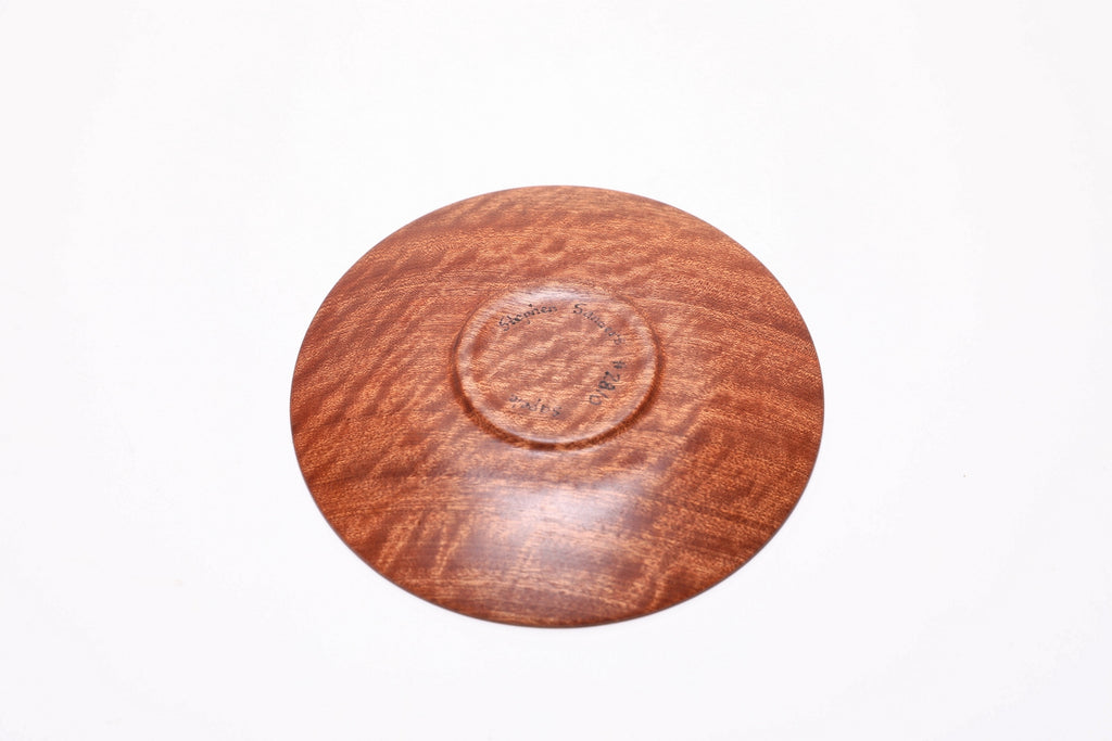 Pommele ribbon sapele wooden ring dish, bottom view showing raised foot and natural finish