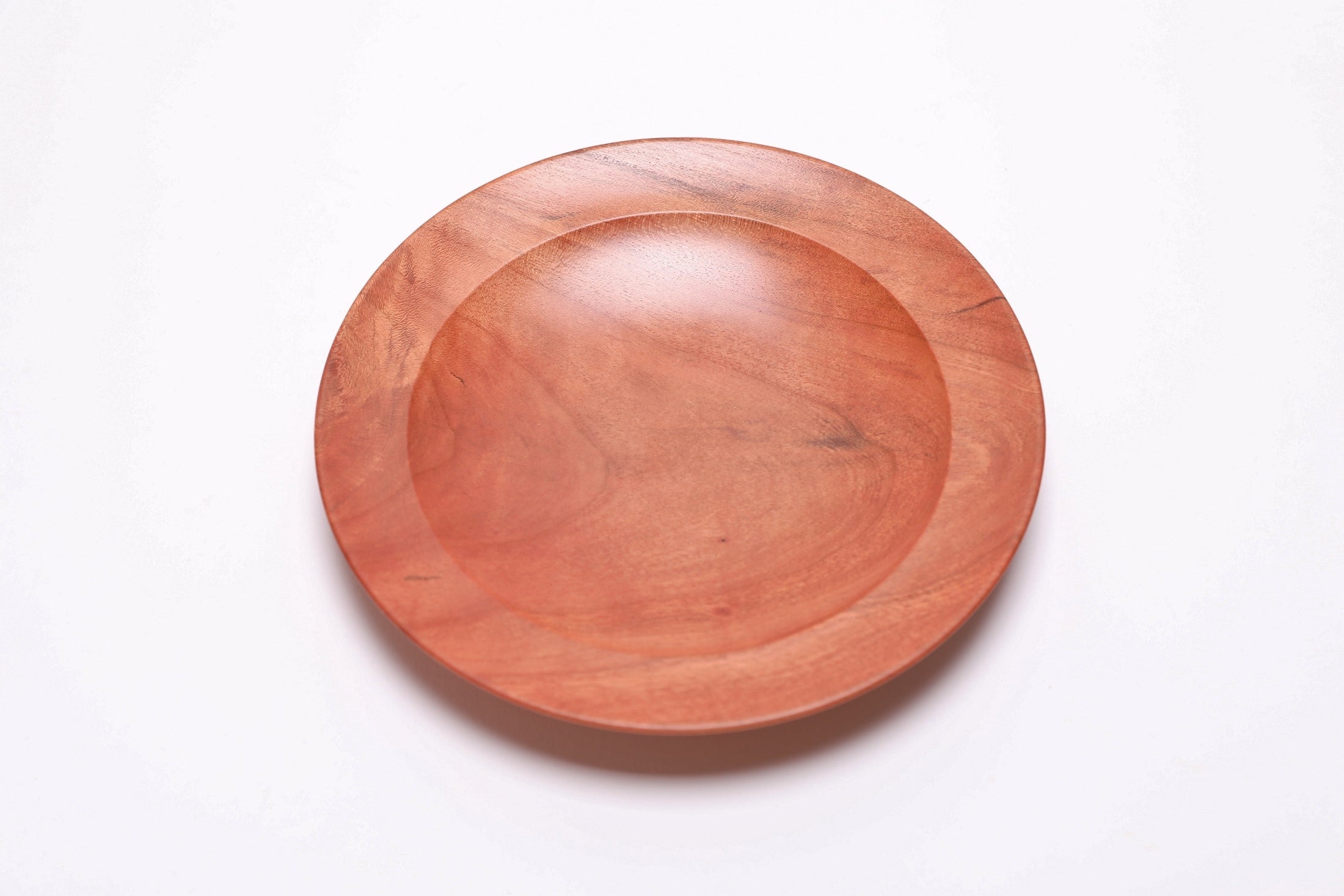 Wild black cherry wooden ring dish, top view at 90°, highlighting gray and brown markings and curved rim