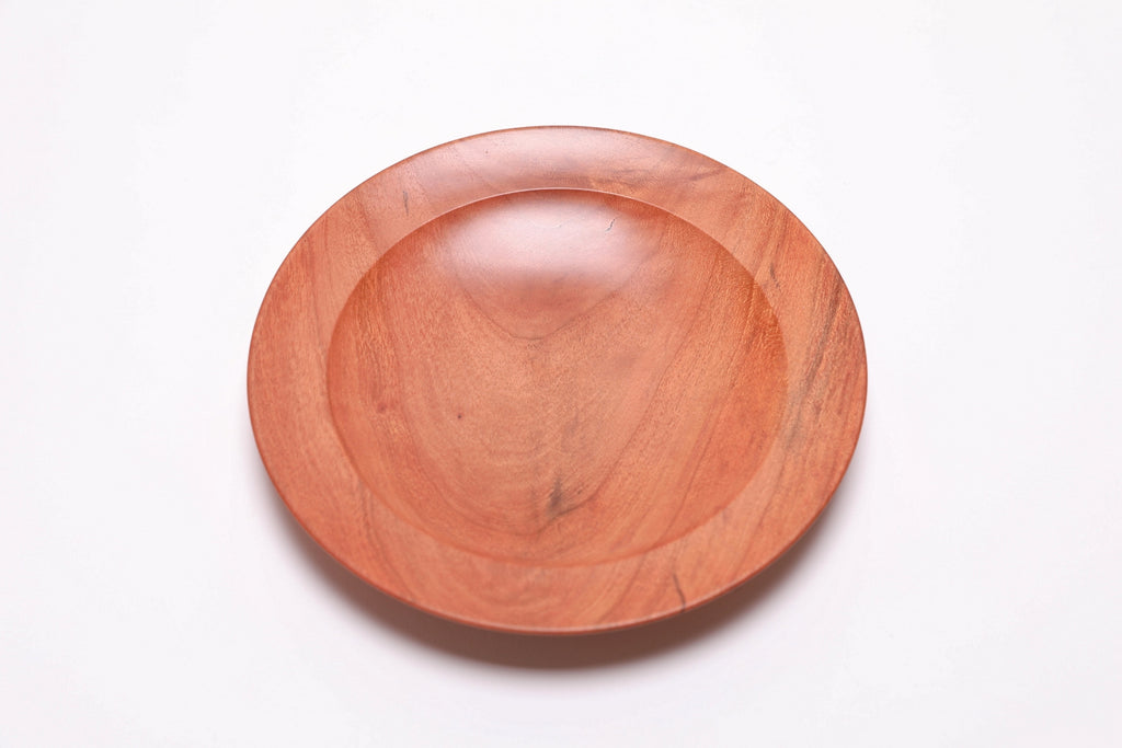 Wild black cherry wooden ring dish, top view at 180°, rich pink-orange color and undercut rim detail