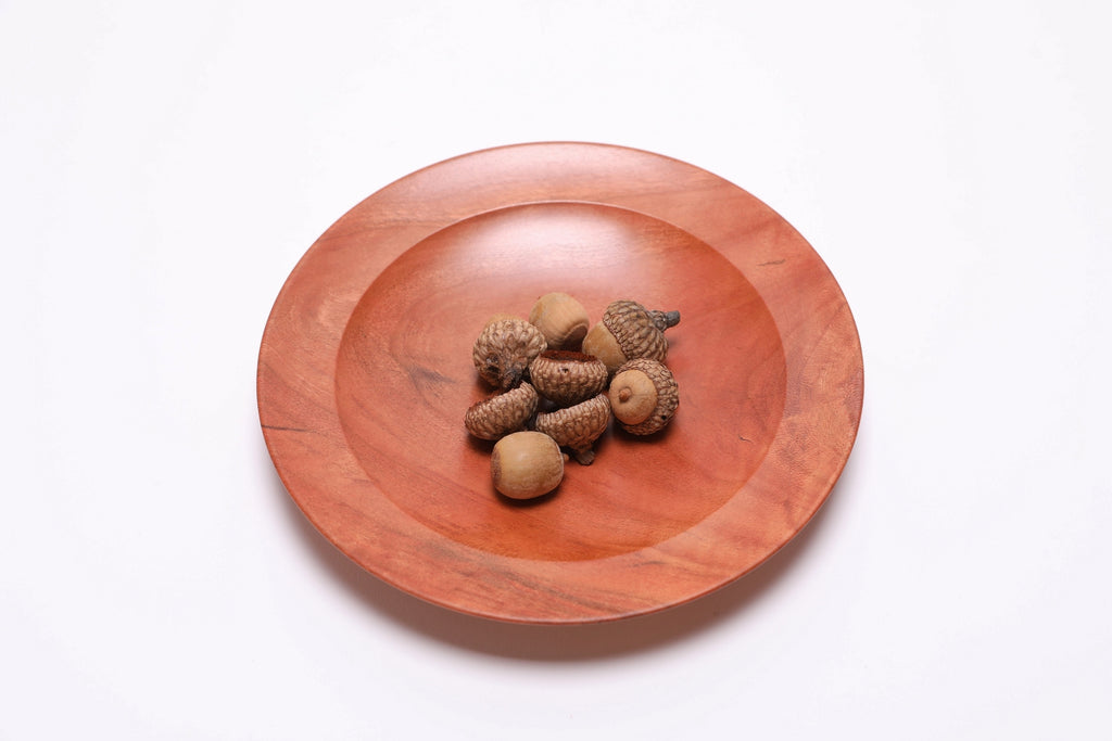 Wild black cherry wooden ring dish shown with acorns for scale — acorns not included