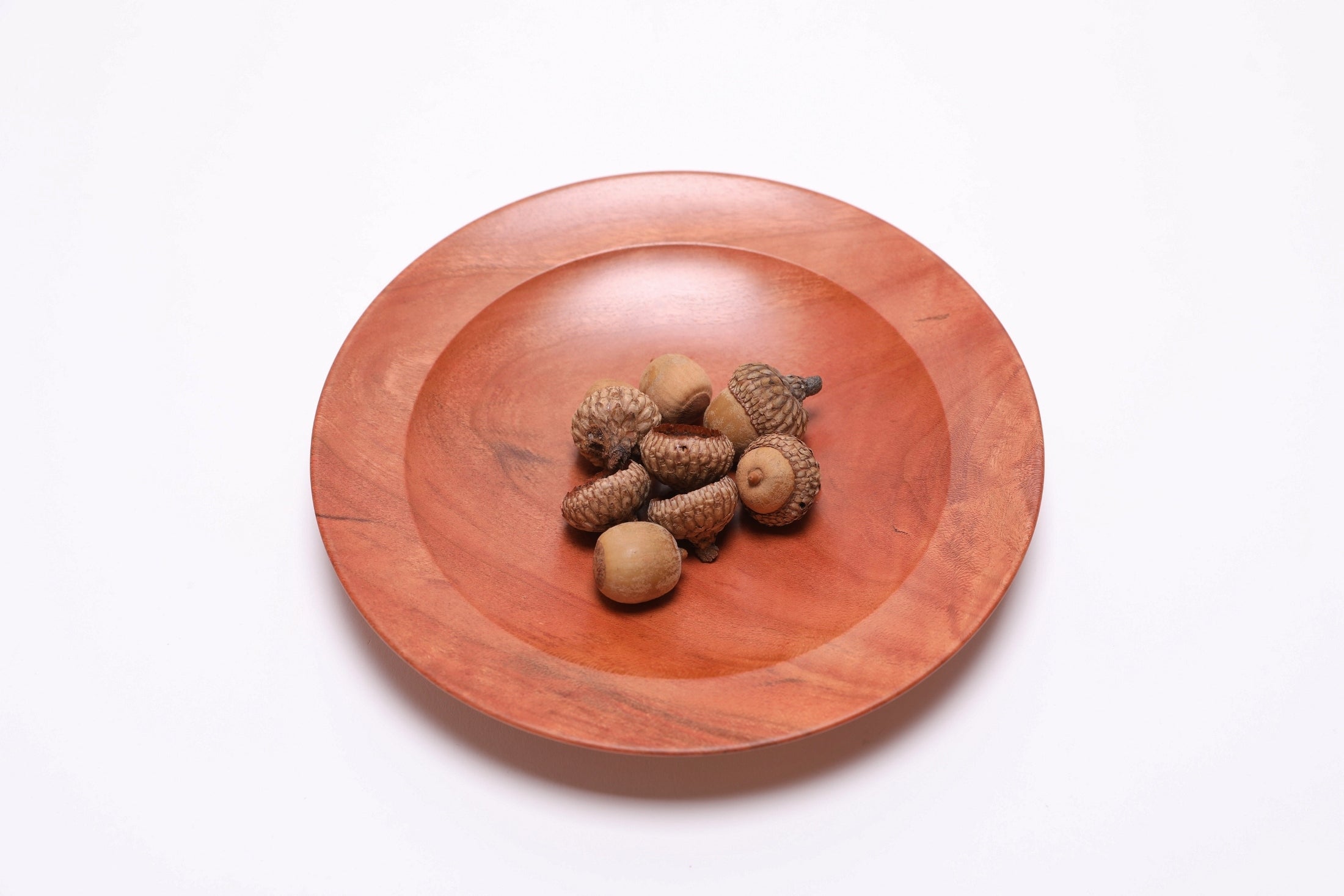 Wild black cherry wooden ring dish shown with acorns for scale — acorns not included