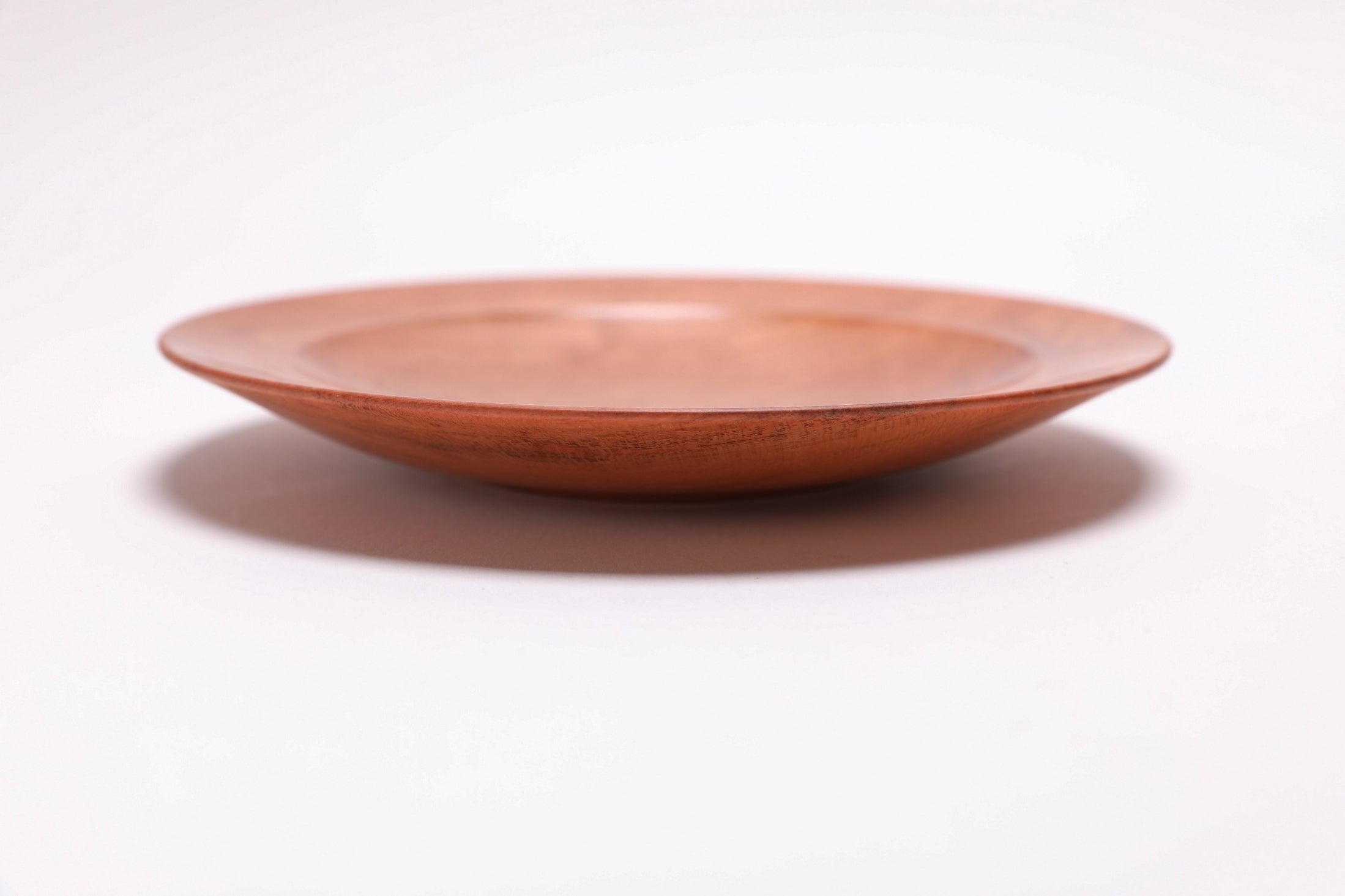 Wild black cherry wooden ring dish, side view showing 1" depth and raised foot