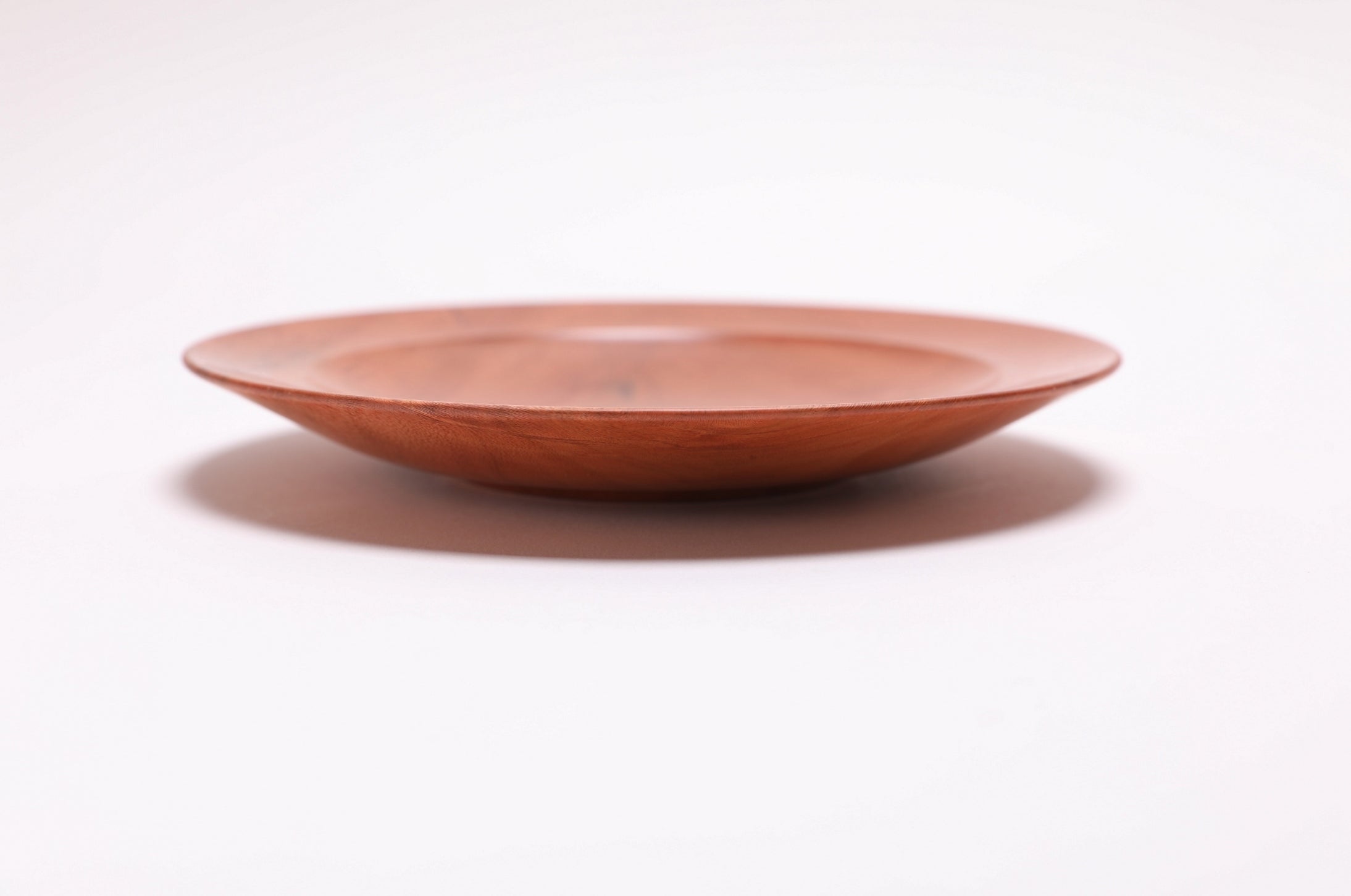 Wild black cherry wooden ring dish, side view showing curved taper and handcrafted profile