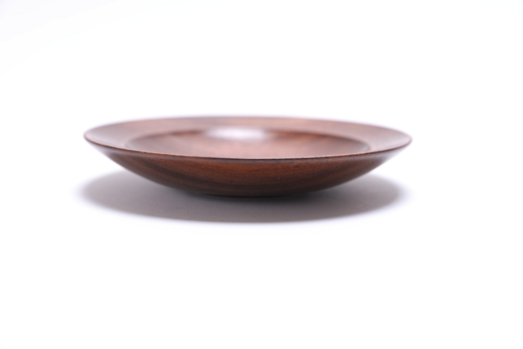 Quartersawn wild black walnut wooden ring dish, side view at 90°, rounded rim and handcrafted profile