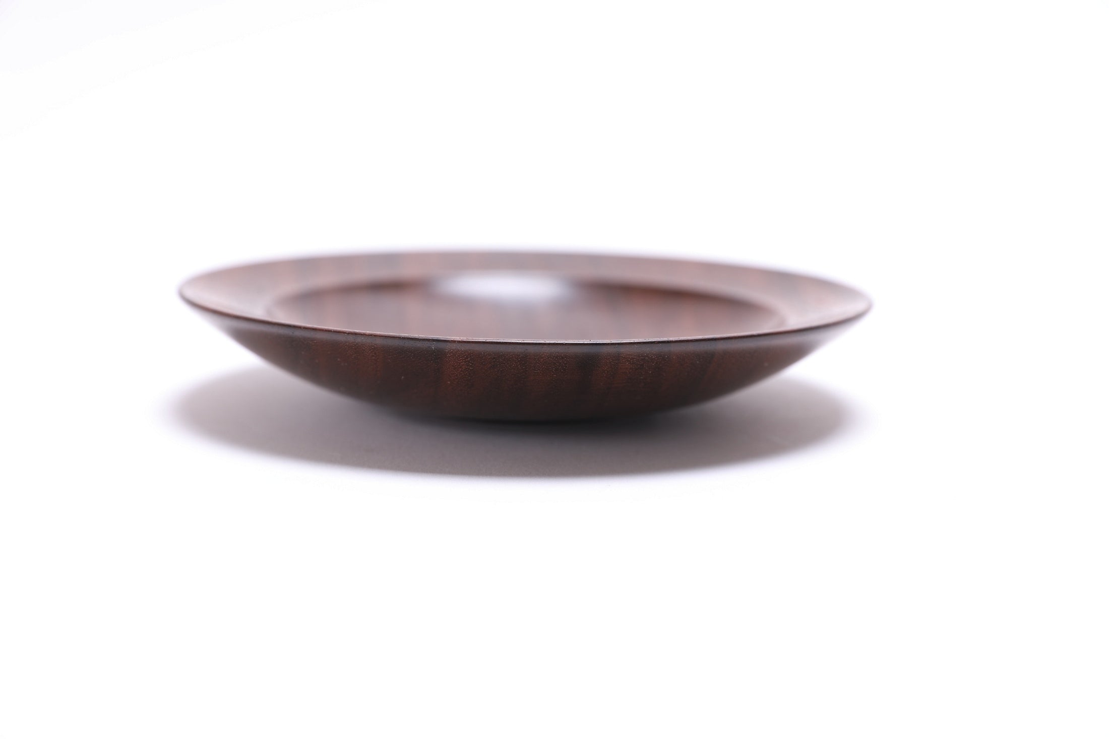 Quartersawn wild black walnut wooden ring dish, side view at 180°, natural oil finish and turned form