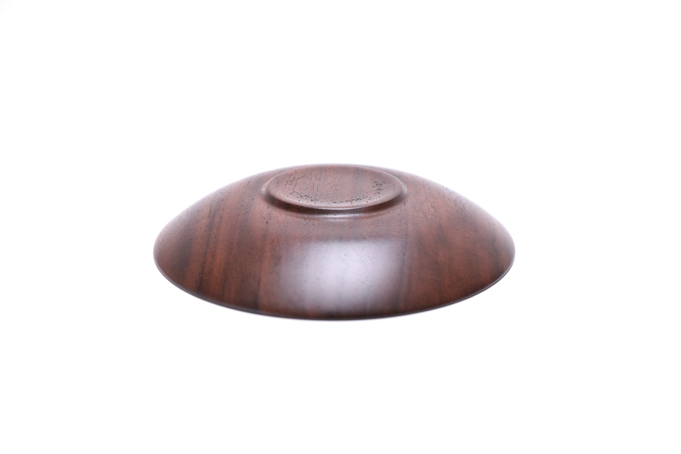 Quartersawn wild black walnut wooden ring dish, bottom view showing raised foot and natural finish