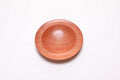 Wild black cherry wooden ring dish, top view at 0°, showing bullseye figure and red highlights