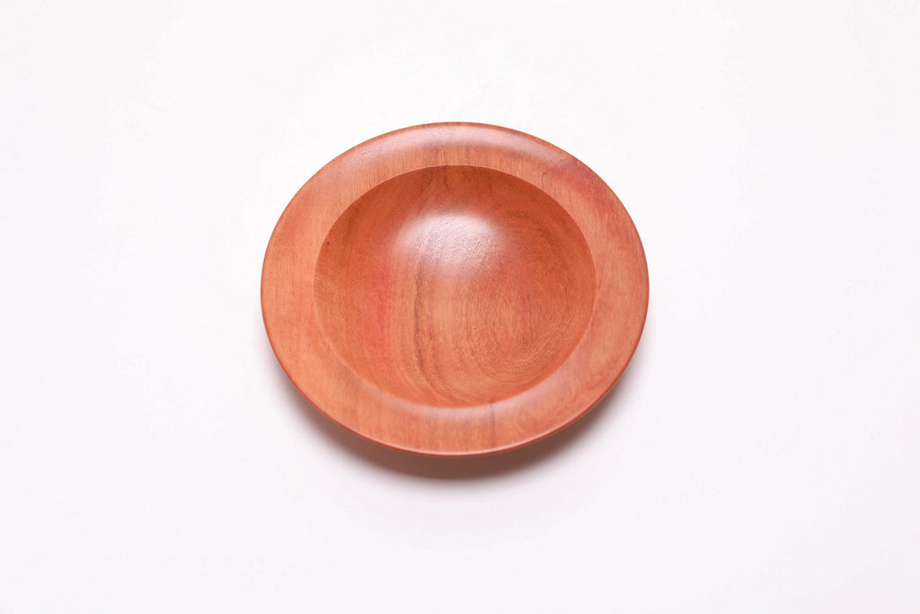 Wild black cherry wooden ring dish, top view at 90°, highlighting amber growth ring transition lines and natural grain