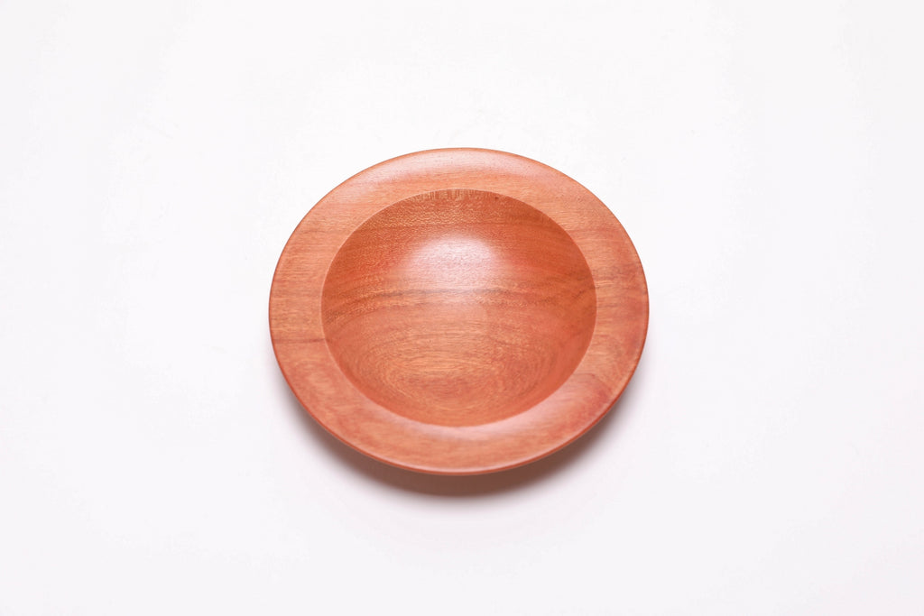Wild black cherry wooden ring dish, top view at 180°, oblong bullseye figure and curved undercut rim