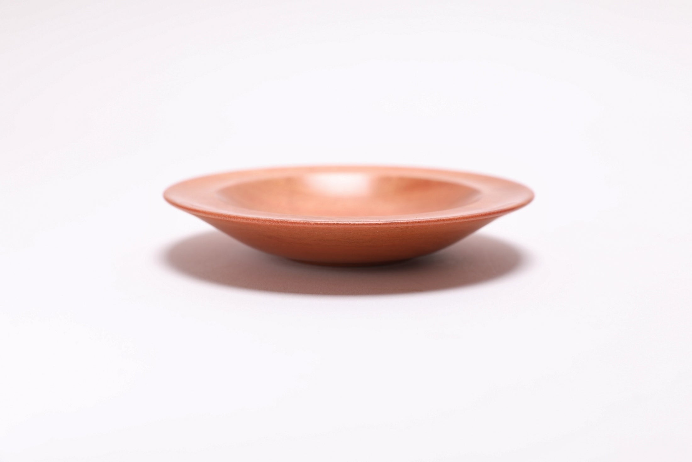 Wild black cherry wooden ring dish, side view at 0°, showing ¾" depth, curved taper, and raised foot