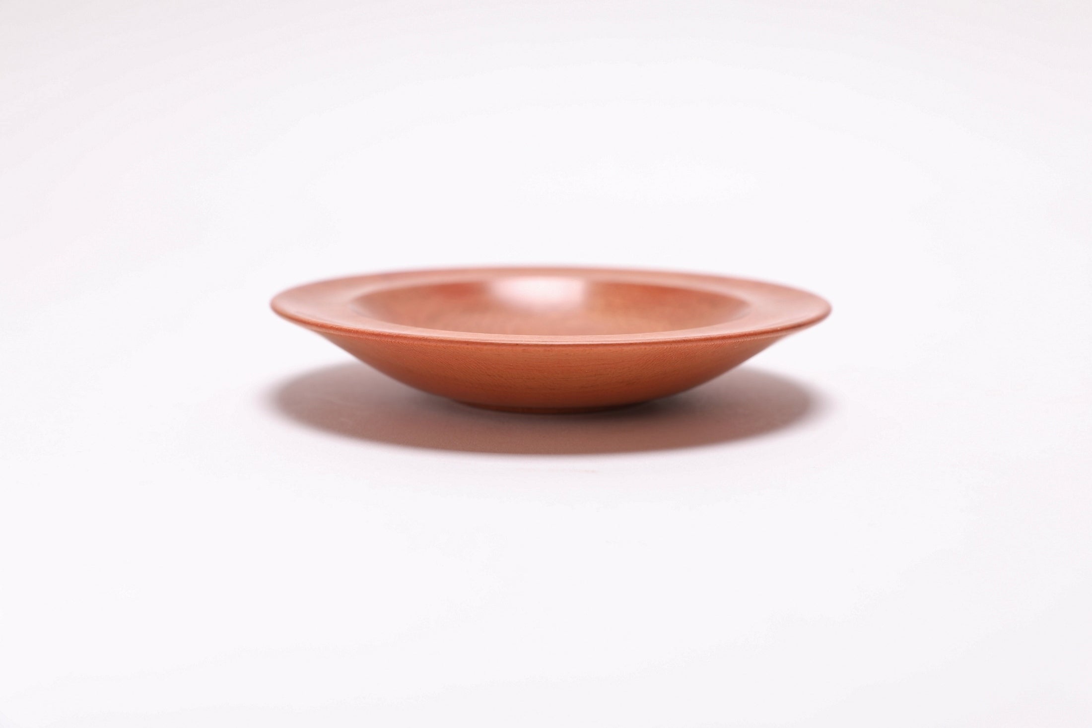 Wild black cherry wooden ring dish, side view at 180°, natural oil finish and turned form