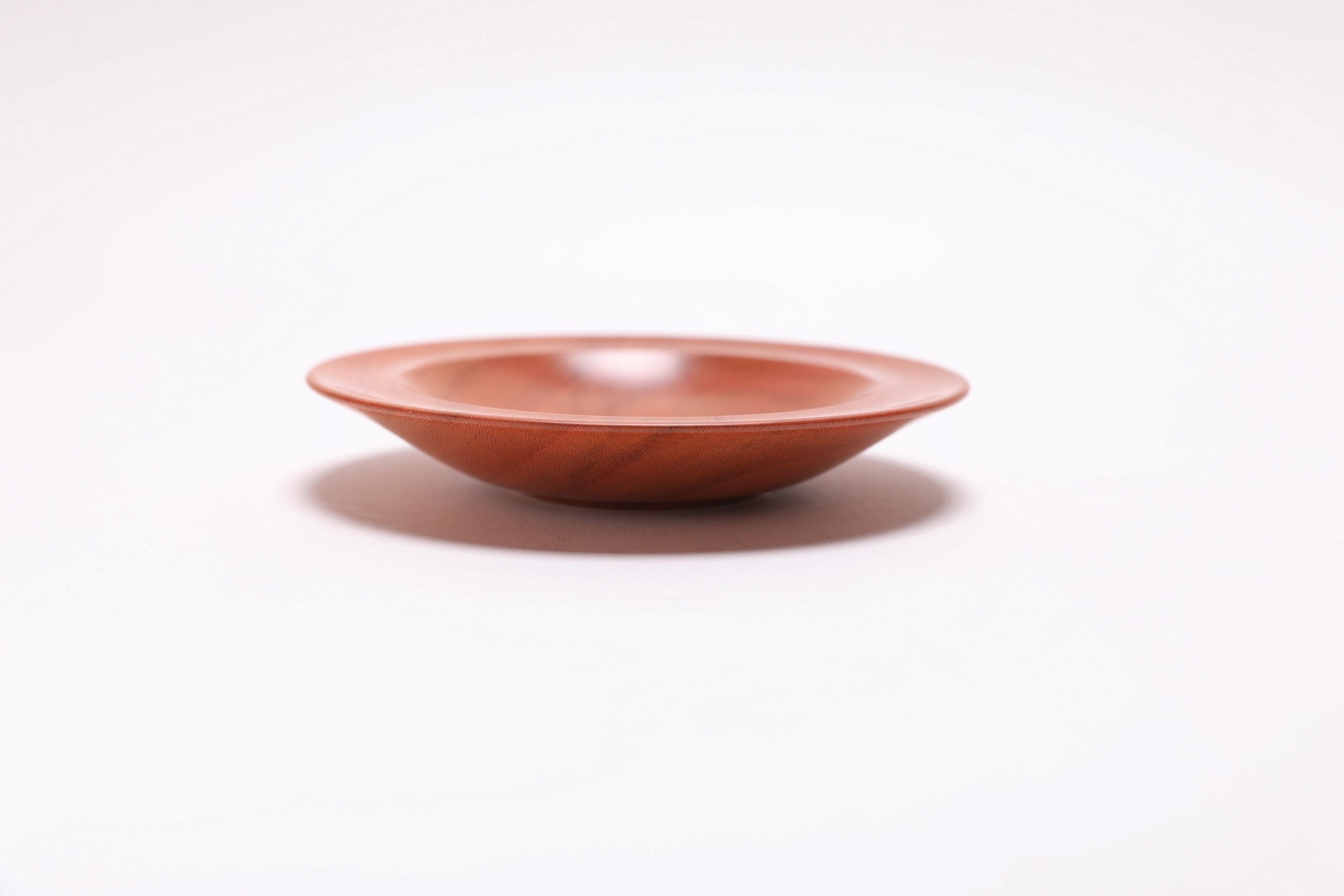 Wild black cherry wooden ring dish, side view at 270°, raised foot and rich cherry color visible
