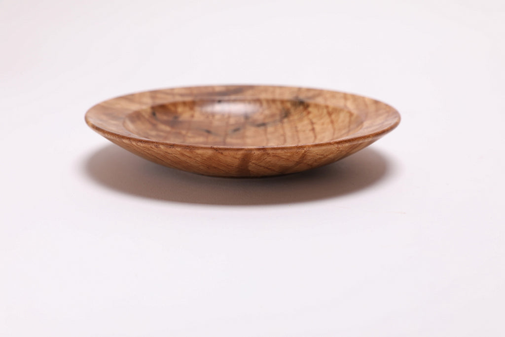Wormy white oak crotch burl wooden bowl, side view at 180°, worm hole character and burl figure visible