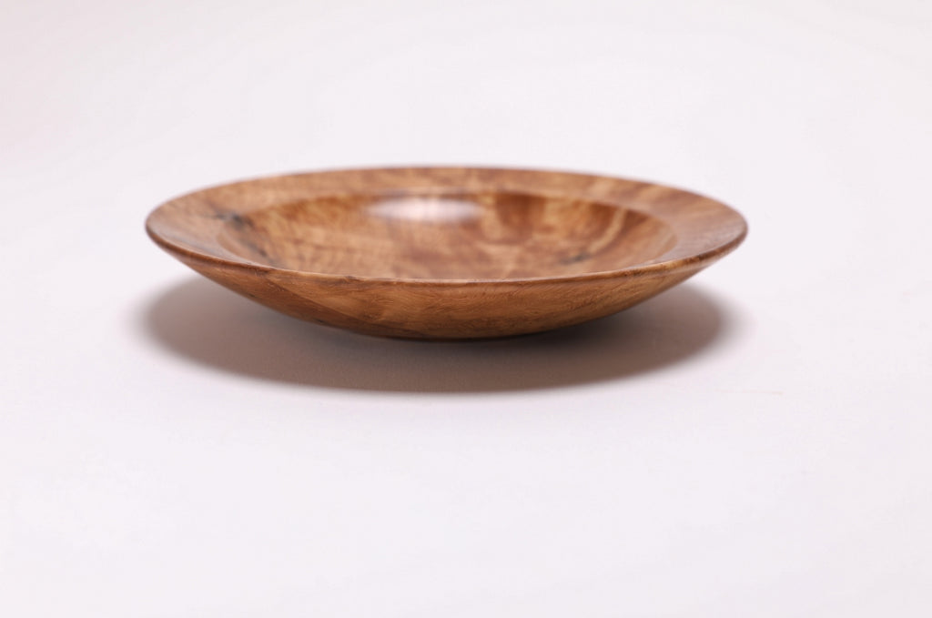 Wormy white oak crotch burl wooden bowl, side view at 270°, raised foot and rich oak color