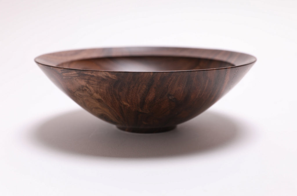 Wild black walnut crotch burl wooden bowl, side view at 0°, showing 2¼" depth, curved taper, and raised foot