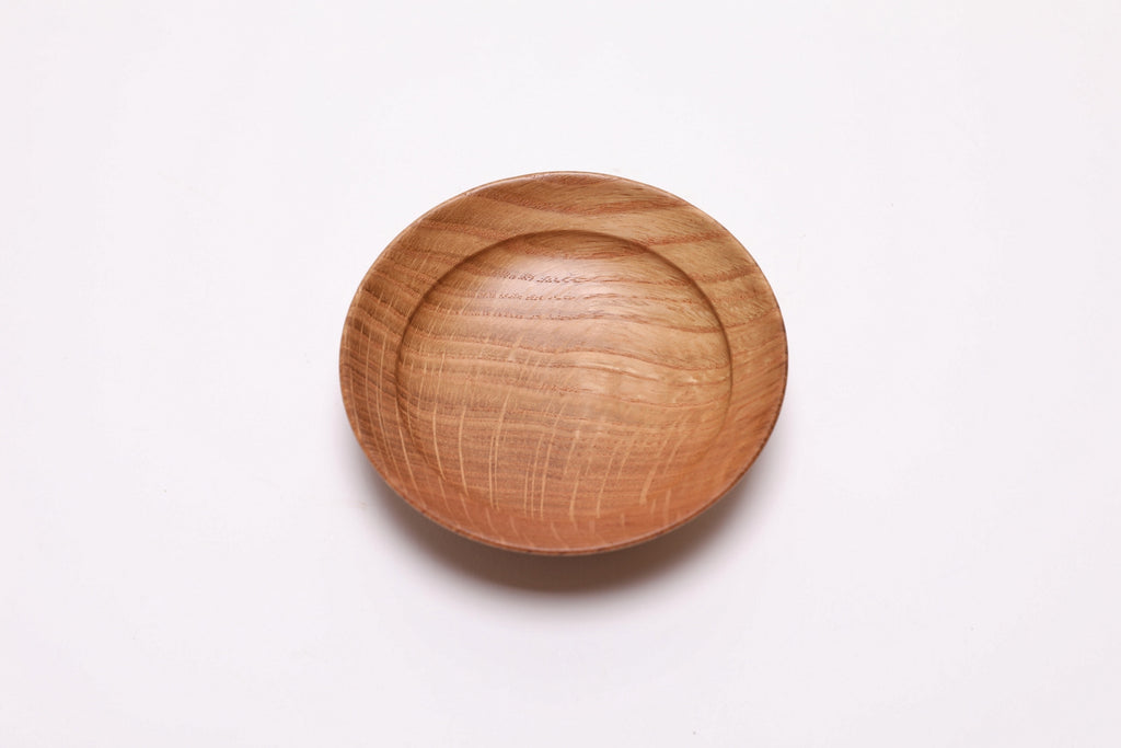 Quartersawn white oak wooden ring dish, top view at 0°, showing shooting star rays and natural grain