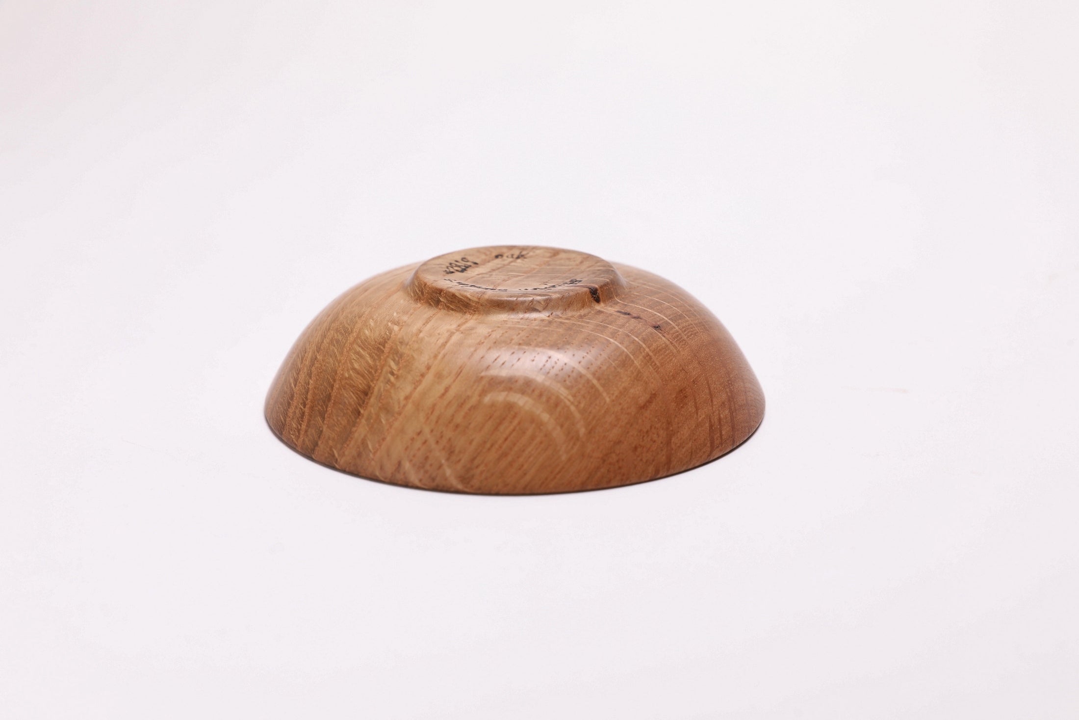 Quartersawn white oak wooden ring dish, bottom view showing raised foot and natural finish
