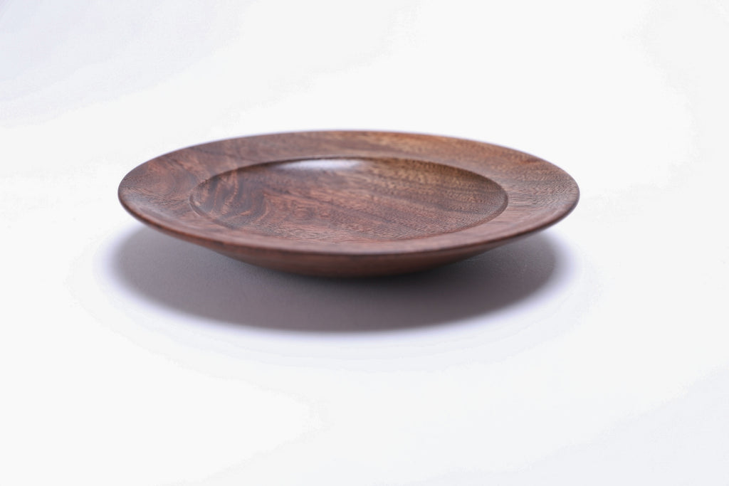 Black walnut crotch burl wooden jewelry dish, side view at 90°, rounded undercut rim and handcrafted profile