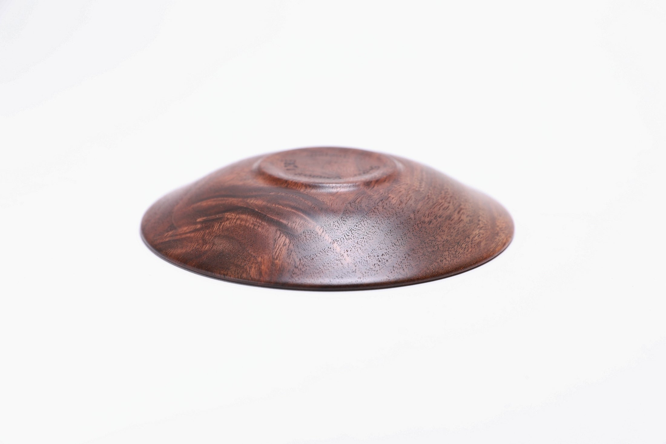 Black walnut crotch burl wooden jewelry dish, bottom view showing raised foot and natural finish