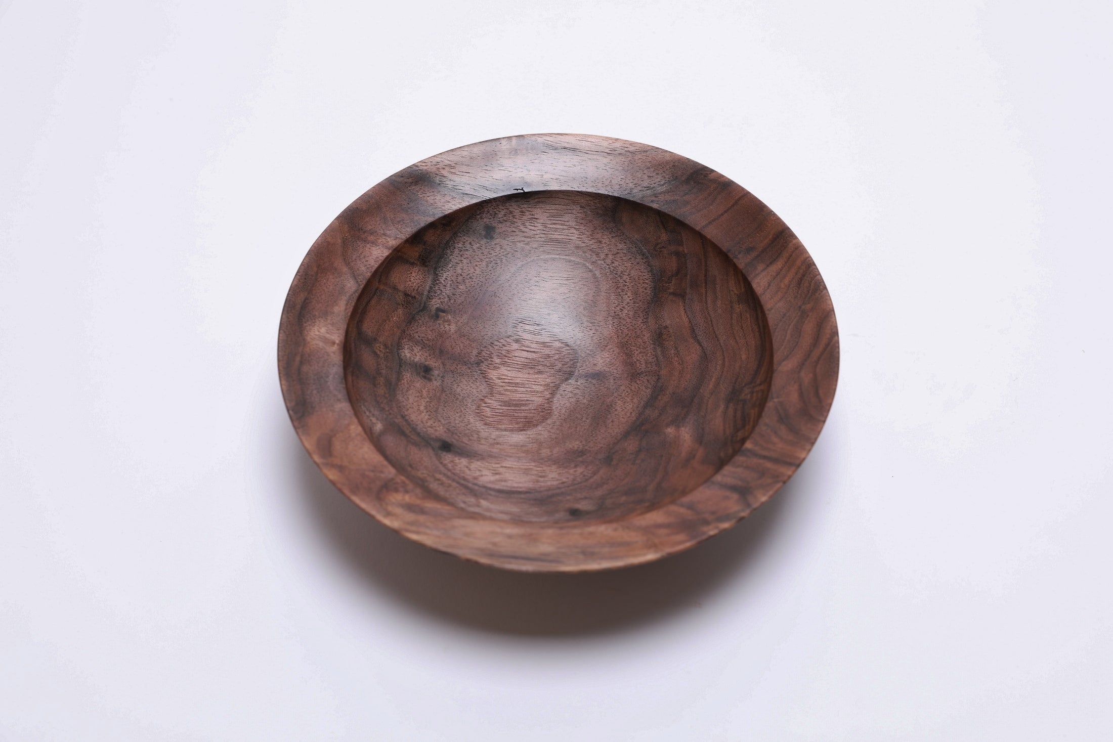 Curly wild black walnut wooden bowl, top view at 270°, rich figure and food-safe oil finish