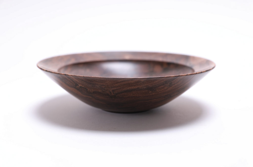 Curly wild black walnut wooden bowl, side view at 0°, showing 1¾" depth, curved taper, and raised foot