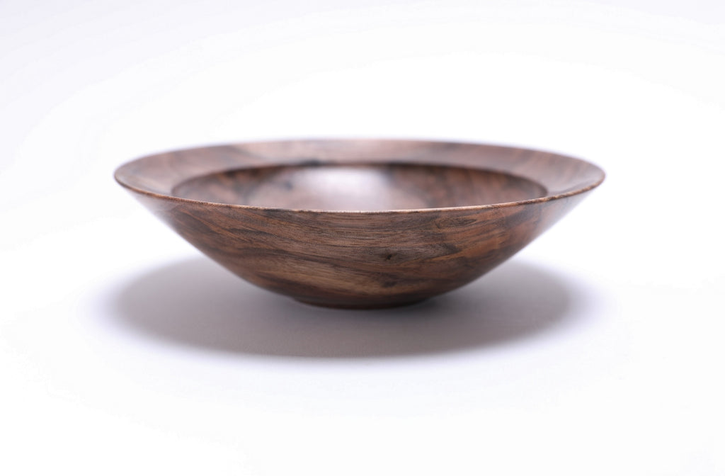 Curly wild black walnut wooden bowl, side view at 90°, rounded undercut rim and handcrafted profile