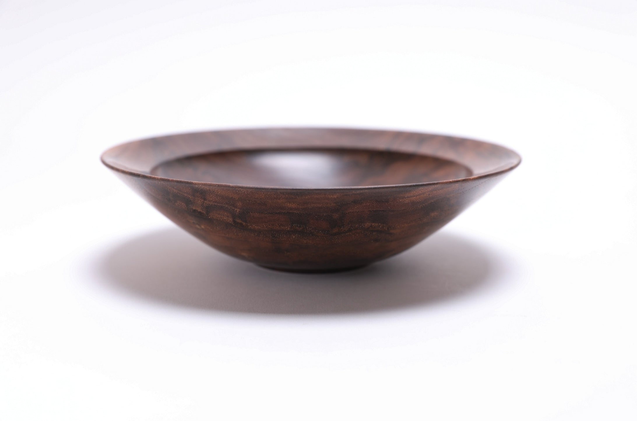 Curly wild black walnut wooden bowl, side view at 180°, natural oil finish and turned form