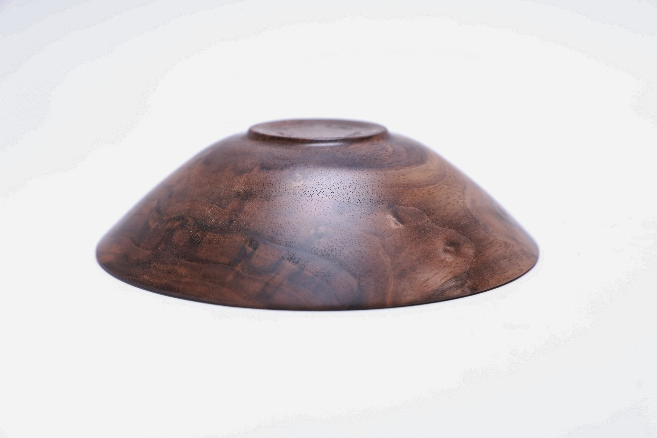  Curly wild black walnut wooden bowl, bottom view showing raised foot and natural finish