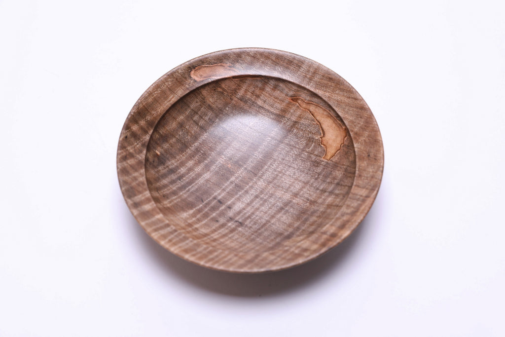 Spalted tiger ambrosia maple wooden bowl, top view at 45°, highlighting spalting lines and tiger figure