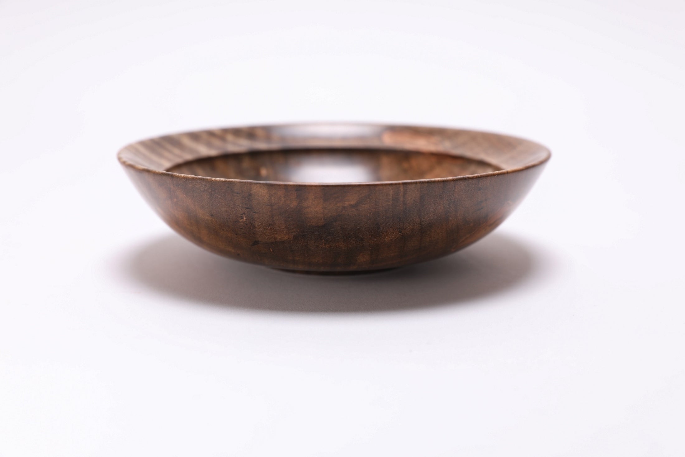 Spalted tiger ambrosia maple wooden bowl, side view at 90°, rounded undercut rim and handcrafted profile