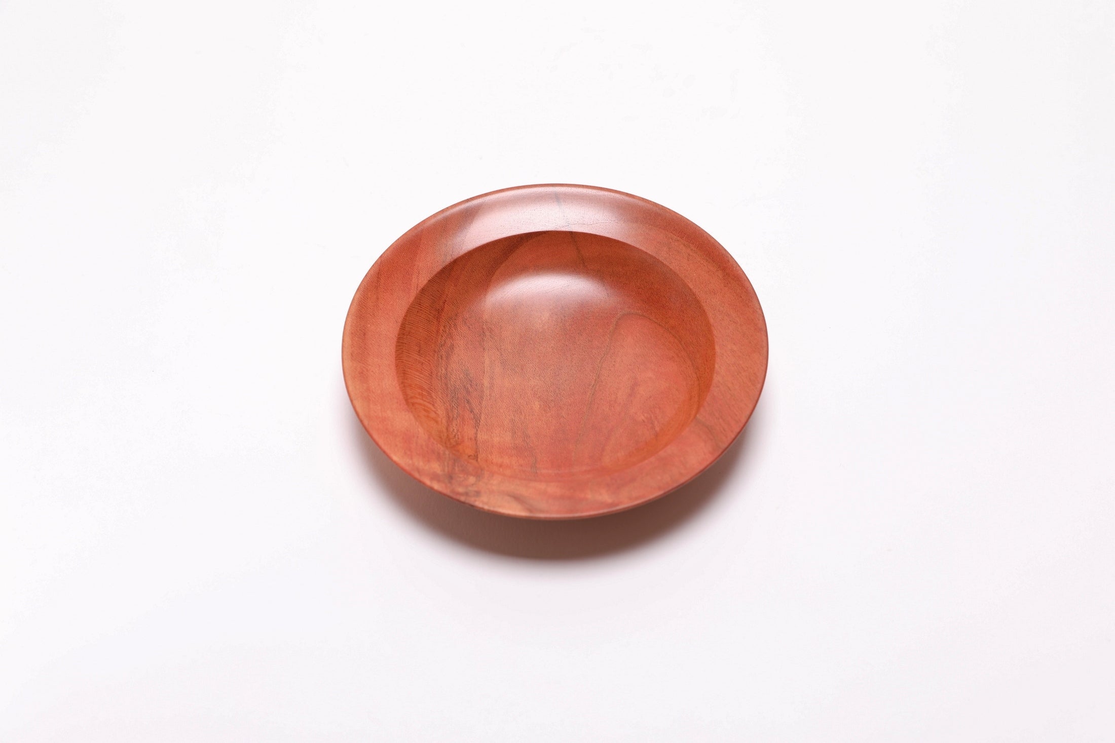 Wild black cherry wooden ring dish, top view, 270°, raised foot and undercut rim visible