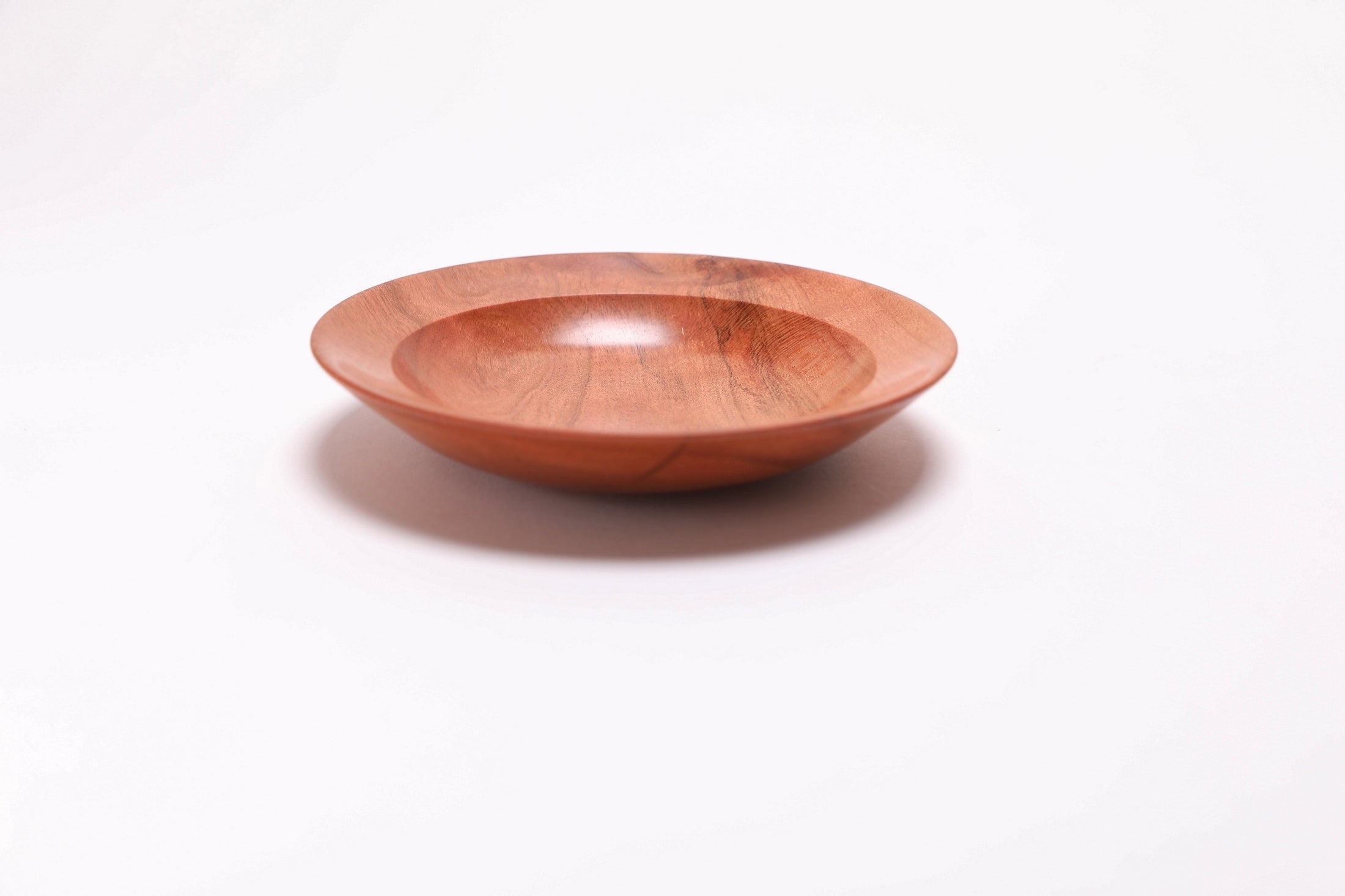 Wild black cherry wooden ring dish, angled side view, 270°, undercut rim and wood grain