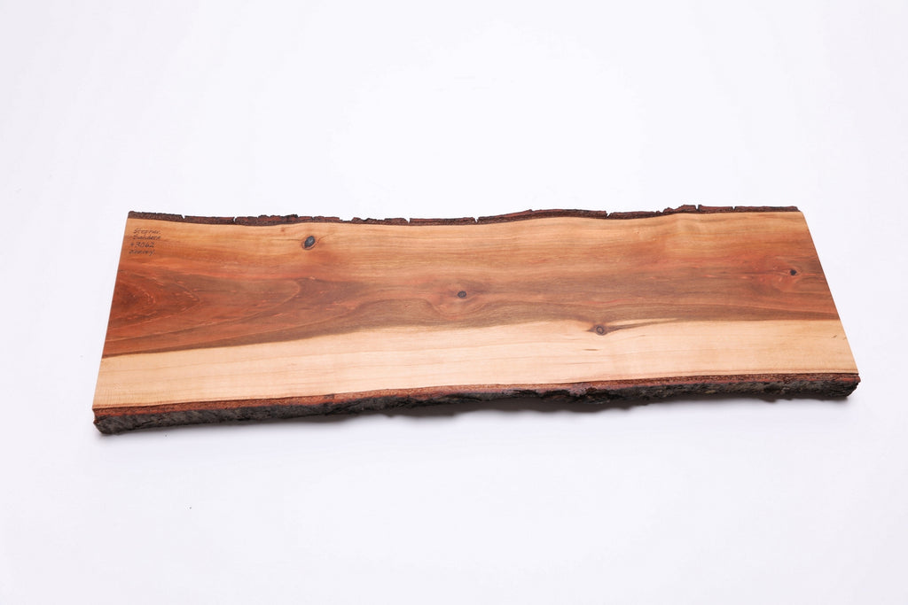 Bottom view of wild black cherry charcuterie board showing natural wood surface and thickness