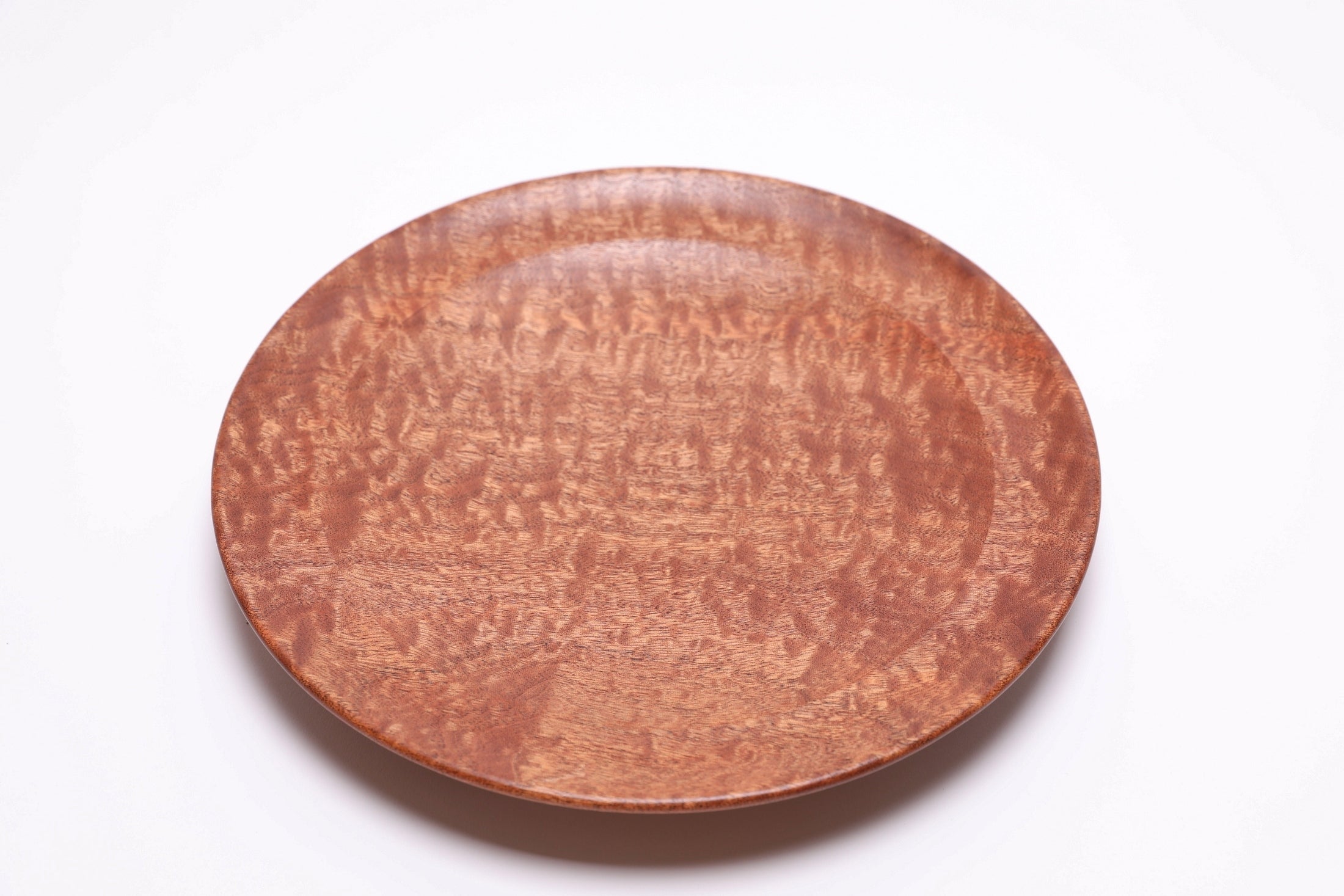 Pommele sapele shallow bowl top view 2, chatoyant figure and mahogany tones
