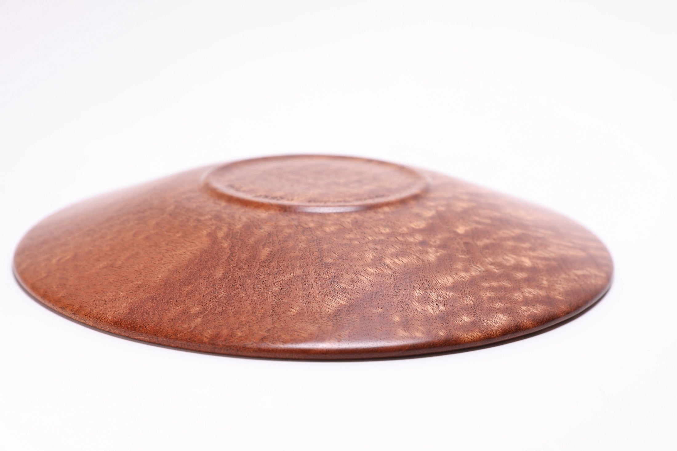 Pommele sapele shallow bowl bottom view, raised foot and food-safe finish