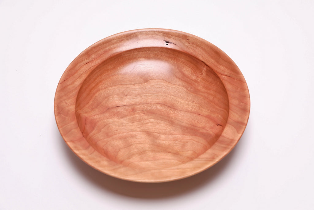 Wild black cherry wooden bowl top view 180 degrees, natural grain and amber transition lines