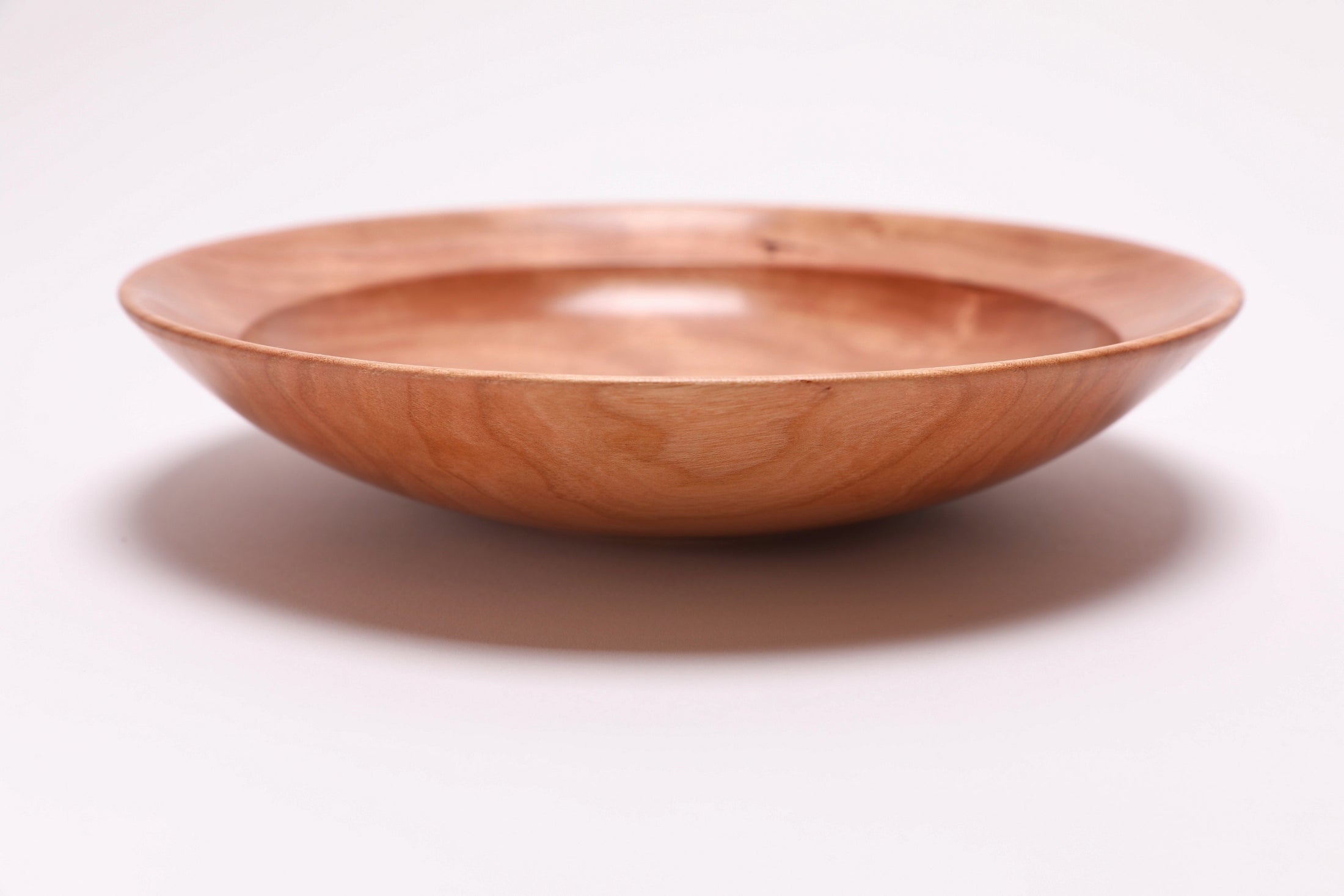 Wild black cherry wooden bowl side view 0 degrees, curved taper and undercut rim, handmade in NC