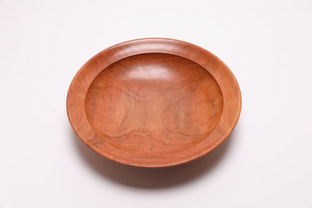 Wild black cherry wooden bowl top view rotated 90°, showing rich grain from 200-year-old cherry tree