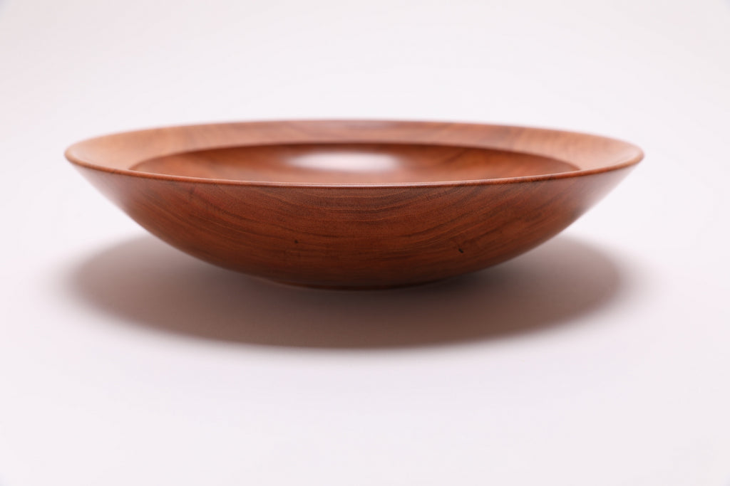 Wild black cherry wooden bowl side view rotated 270°, undercut rim and natural wood grain
