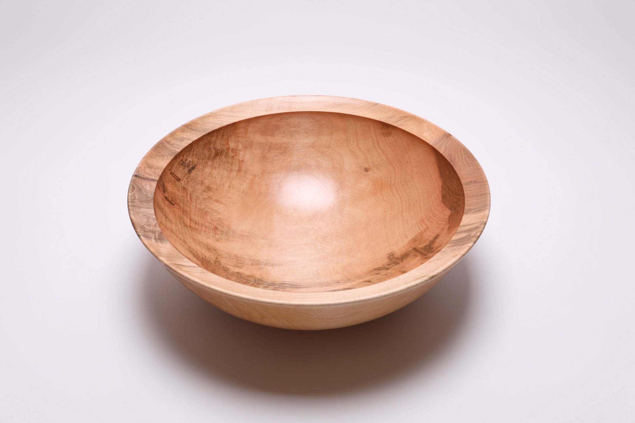 Large sugar maple bowl top view rotated 180°, dark brown heartwood contrasting with lighter sapwood