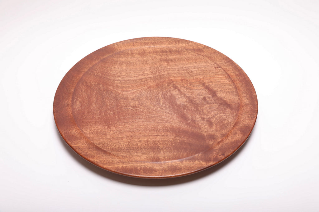 Large Khaya serving platter top view rotated 180°, iridescent grain pattern across full platter surface